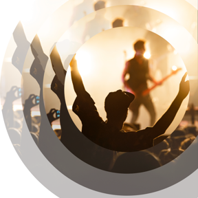 Someone dancing in front of a stage 